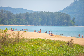 People or traveller relaxing on the sand beach of Phuket Thailand Asia.