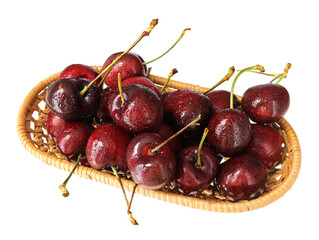 A basket of fresh fruit cherries on a white background