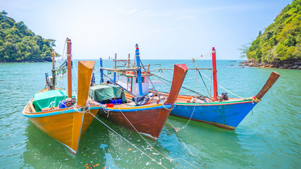 Fishing boat with colorful color on the sea water with three boat. Vintage travel style.