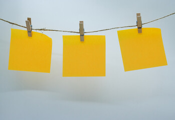 post-it notes hanging on rope