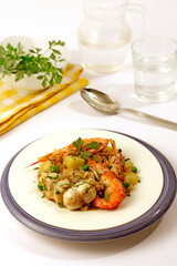 Potatoes with shrimps and monkfish.