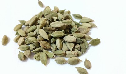 Cardamom seeds on white background