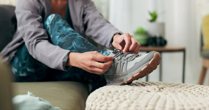 Woman, runner and lacing up shoes in home, morning jog for wellness and cardio fitness health. Exercise, trainers and workout clothes for comfort and support, vitality and running sport for athlete