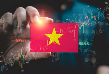 Businessman holding Vietnam flag with stock market graph chat and for Vietnam country is new born economy and high business development growth from many investment concept. - obrazy, fototapety, plakaty