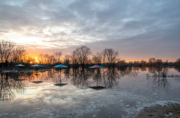 Sunset on the beach flooded by the spring flood on the Solotchinka River, Ryazan region, Russia