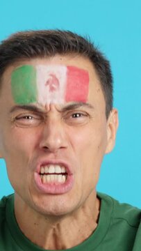Close up of a man supporting mexican team
