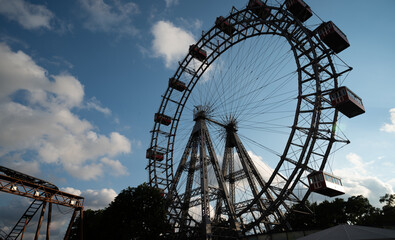 Giant Ferries wheel moving with people in an Amusement park.