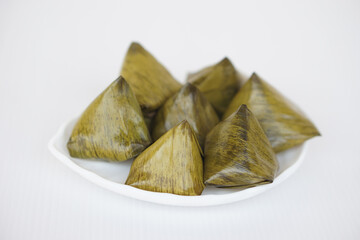 Sweet stuffed dough pyramid or Khanom Tian in Thai language, wrapped by banana leaf and streamed....