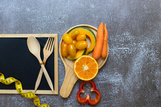 Diet Health eat and food for lifestyle health concept. Sport exercise workout and fresh fruit and measuring tape with backboard for fitness style. Nutrition Healthy Lifestyle Concept, Top view
