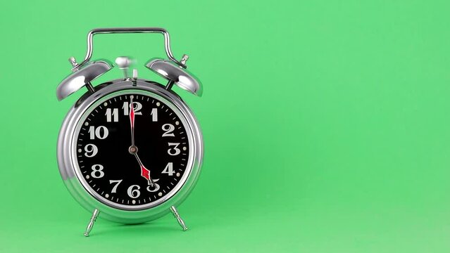 Mechanical alarm clock rings at five in the morning .5 o'clock .copy space. Chroma Key