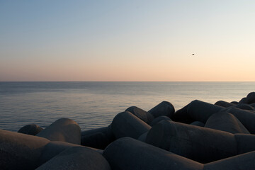 Seascape over the seawall during sunrise