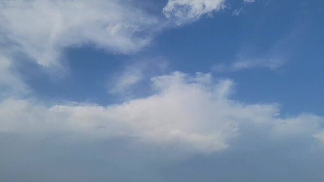 Beautiful view of Cloudy blue sky with green trees in pakistan. Beautiful 4K footage.