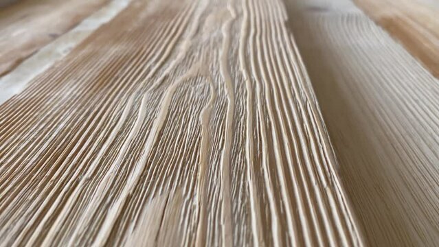 wooden surface. close-up of wood texture. Slow-motion video. High quality video in 4K format.
