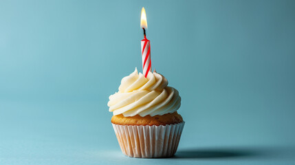 Birthday Cupcake with a Single Lit Candle on Blue