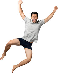 Surprised Caucasian man in sleepwear jumping and raising fists PNG file no background 