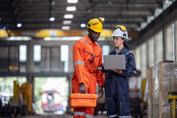 Engineer supervisor uses laptop for train diagnostics, maintenance, and CO2 reduction discussions.