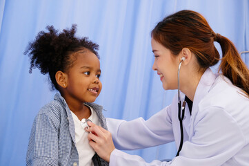 Doctor treating a young patient Pediatric doctor concept.