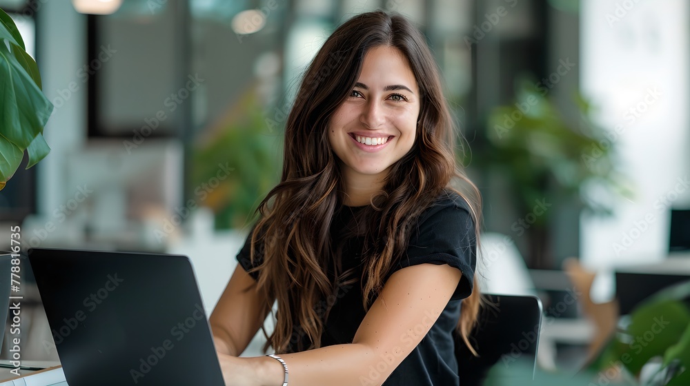 Poster Smiling Young Woman Working on Laptop in Modern Office Space. Casual Business Style, Freelancer at Work. Contemporary Worker Portrait. AI