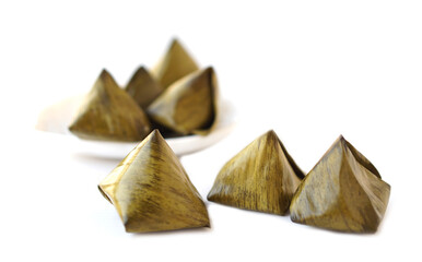 Sweet stuffed dough pyramid or Khanom Tian in Thai language, wrapped by banana leaf and streamed. Concept.  Thai traditional dessert.  Prepare food for cultural celebration events.