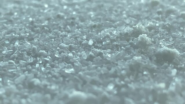 floating. Magnesium sulfate. Epsom salt.salt. salt crystals. Slow motion video. High quality video in 4K format.