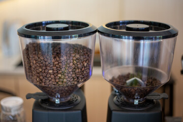 selective focus coffee bean grinder in coffee shop There are tons of coffee pellets all over the...