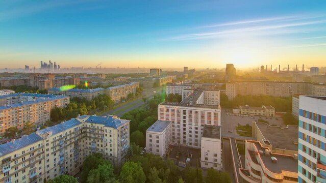 Residential buildings on Leninskiy avenue, Stalin skyscrapers and panorama of the city at sunrise timelapse in Moscow, Russia. Traffic on the road. Aerial view from rooftop