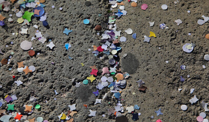 Colorful confetti background on the square floor after celebrations