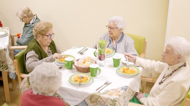 Top view of people eating in a nursing home - Powered by Adobe