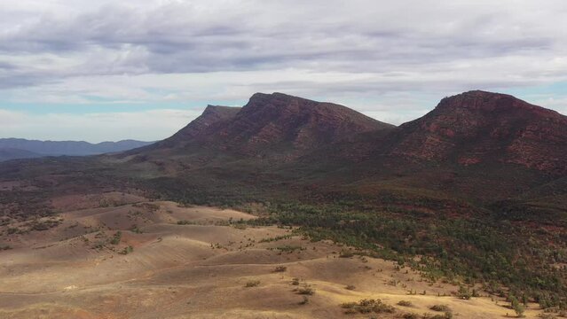 Wilpena Pound resort the Gap aerial flying to scenic mountain peak in South Australia.
