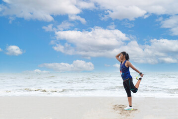 Fototapeta na wymiar Athletic woman jogging exercise and relax and freedom on sand beach.Lifestyle and Healthy Concept.