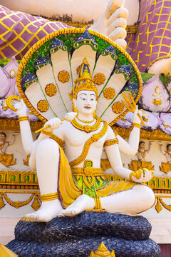 Colorful Thai Deity Statue with Multiple Arms in Thailand