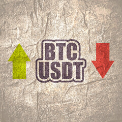 Financial market concept. Currency pair. Acronym BTC - Bitcoin cryptocurrency. Acronym USDT - United States Dollar cryptocurrency stablecoin.