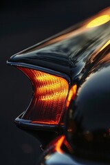 A close-up shot of a car's resonator tip, bathed in the warm glow of sunlight and showcasing its vibrant colors.