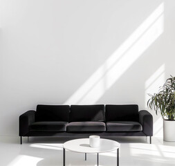 Template of minimalist white photo studio room with black sofa. Interior mockup with clean walls for pictures, posters, paintings, sculptures, and other wall art. 