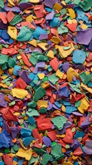 Fototapeta na wymiar Colorful recycled plastic pieces background