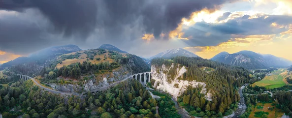 Rolgordijnen Landwasserviaduct Aerial view of Train passing through famous mountain in Filisur, Switzerland. Landwasser Viaduct world heritage with train express in Swiss Alps