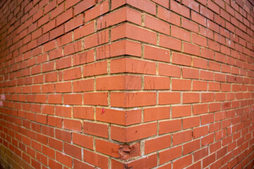 Red brick wall background outside of the building, London, UK.