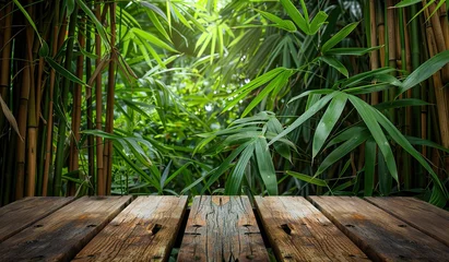Foto op Plexiglas Wooden table with a tranquil bamboo forest background © volga