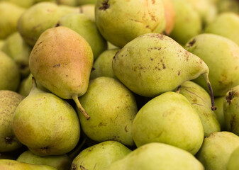 Delicious pears on a market counter
