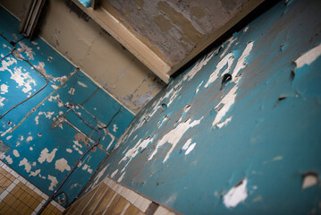 Shabby wall of old abandoned house abstract background.