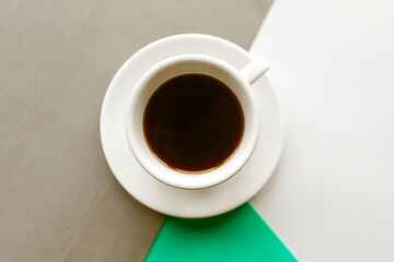 Coffee cup on color background. Flat lay photo, minimal concept