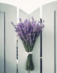 A fragrant bushel of purple lavender tied to a rustic garden gate, inviting passersby with its soothing aroma and vibrant color
