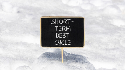 Short-term debt cycle symbol. Concept words Short-term debt cycle on beautiful black chalk blackboard. Beautiful white snow background. Business Short-term debt cycle concept. Copy space