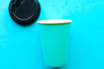 Take away coffee cup on blue background, minimal concept