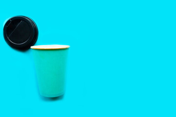 Take away coffee cup on blue background, minimal concept. Copy space for the text