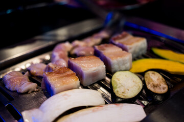 Yummy Korean BBQ, pork belly and vegetable on grilling pan