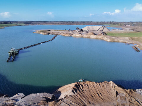 Gravel pit aerial perspective Panoramic landscape excavation lake water