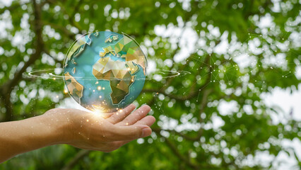 Sustainable  Environment concept. Green earth planet in hands with shining light. Save and...