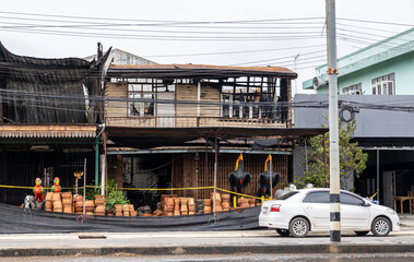 A view of the condition of a two-storey wooden house next to each other which was damaged.