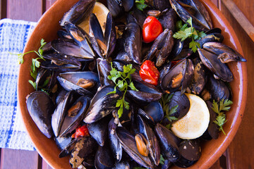 Moscioli or Cozze del Conero Ancona cooked in a pan with cherry tomatoes, garlic, parsley and...